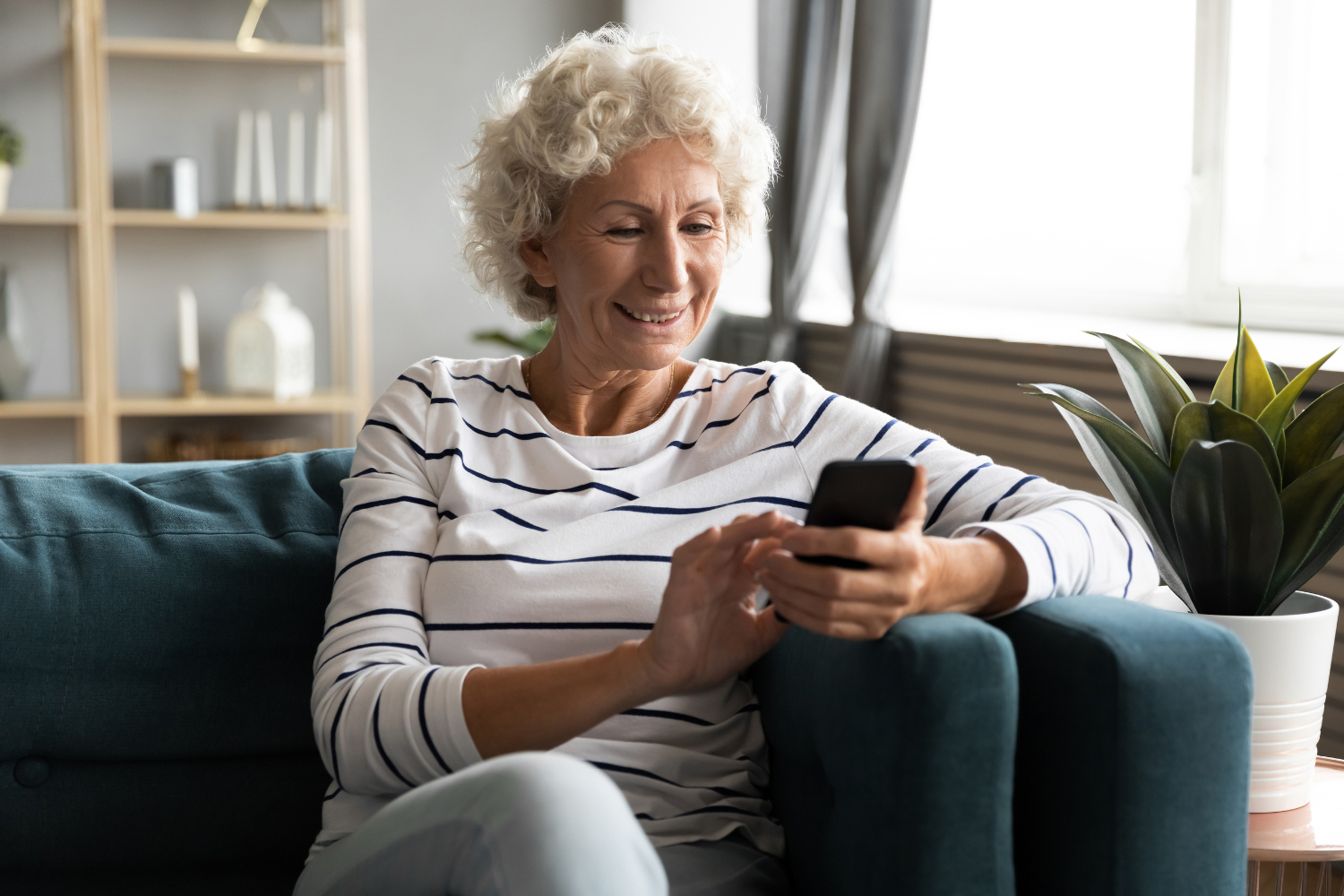 Woman on the phone smiling and sitting